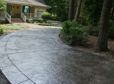 Long dark stained and textured driveway in Milford.