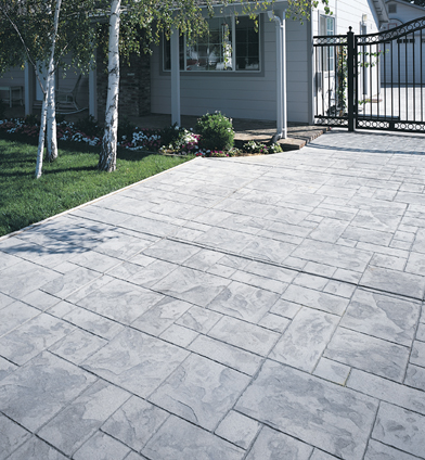 Textured and stamped gray concrete patio.