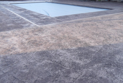 Gray textured decorative concrete pool deck in Milford.