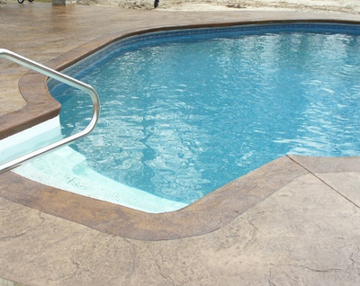 Built in pool deck that is stamped and stained.