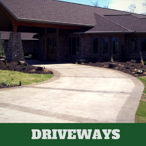 Two toned colored concrete driveway in Milford, CT with brick home.