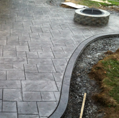 Gray stained and stamped concrete walkway.