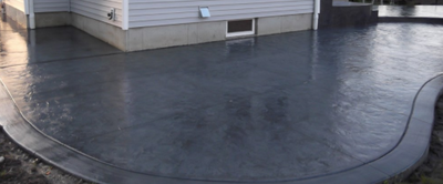 Gray stained and polished stamped concrete in CT.