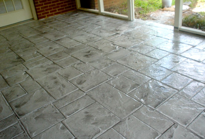 Gray stamped concrete with stone paver style.