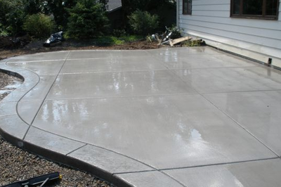 Polished concrete patio with stamped concrete edging.