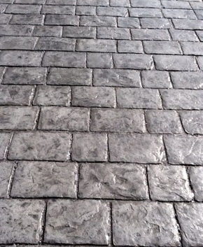 Worn our cobblestone style stamped concrete.