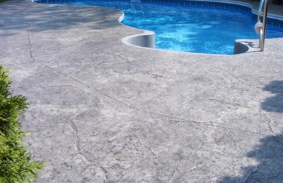 Gray and decorative concrete pool deck.
